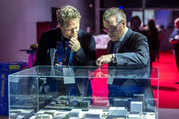 On the right: Hansjörg Fankhauser showing future buildings of uptownBasel